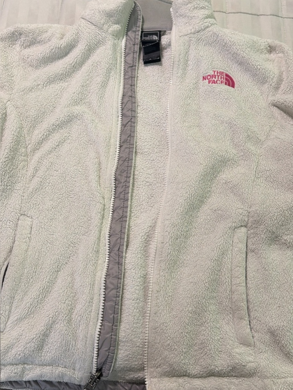 The North Face white Teddy Jacket with Pink Logo